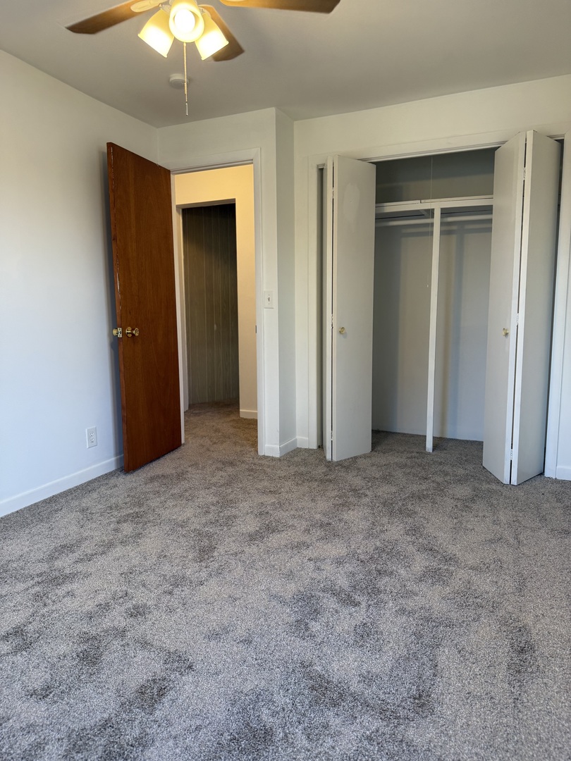 405 North Church Street Princeton, IL 61356 - Photo 20 of 24 a view of an empty room with a chandelier fan