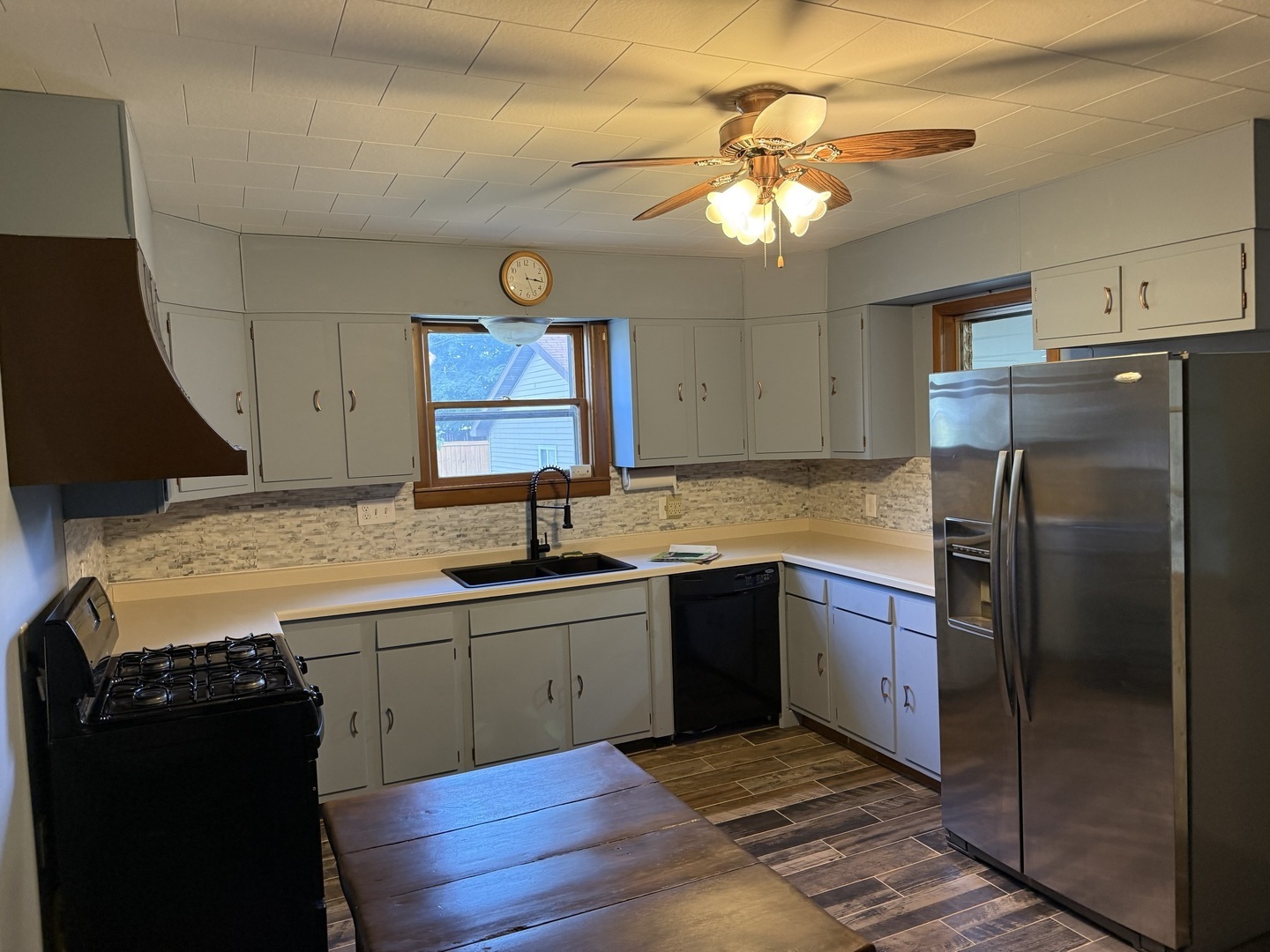 405 North Church Street Princeton, IL 61356 - Photo 7 of 24 a kitchen with stainless steel appliances granite countertop a sink stove and refrigerator