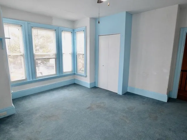 an empty room with windows