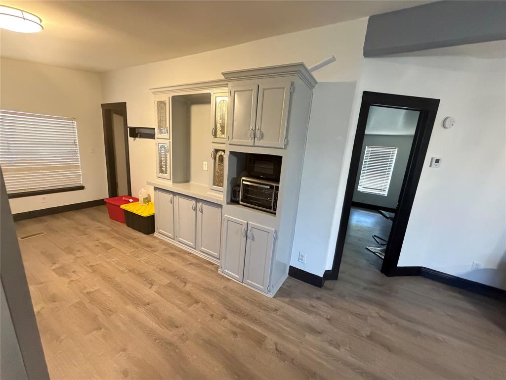 222 Hix Road Cleburne, TX 76031 - Photo 9 of 27 wooden floor and fireplace in a room