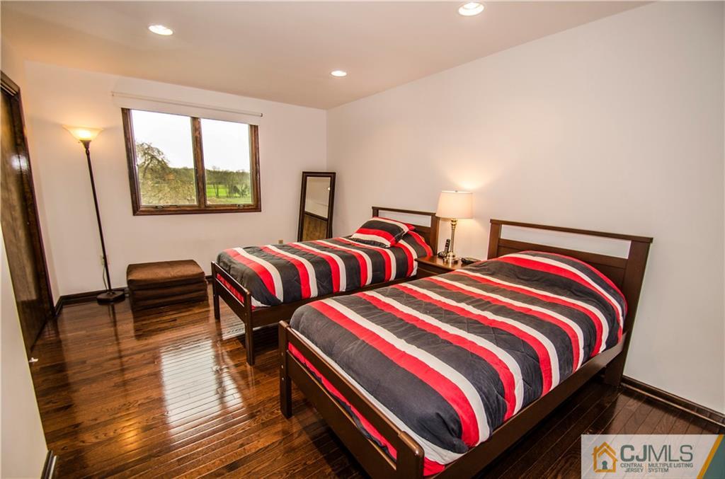 29 Yard Road Pennington, NJ 08534 - Photo 12 of 25 a bedroom with two beds and a chair