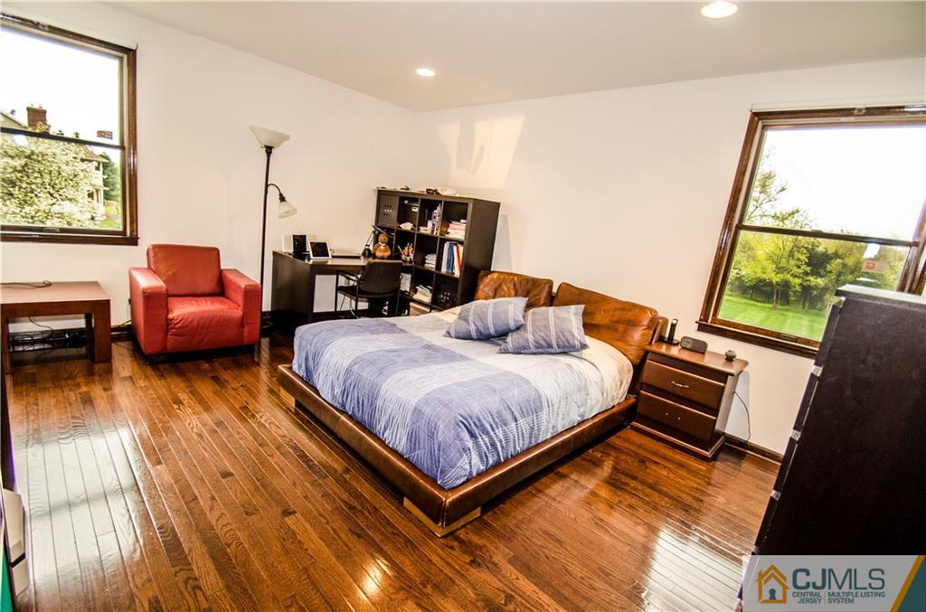 29 Yard Road Pennington, NJ 08534 - Photo 13 of 25 a bedroom with a bed and wooden floor