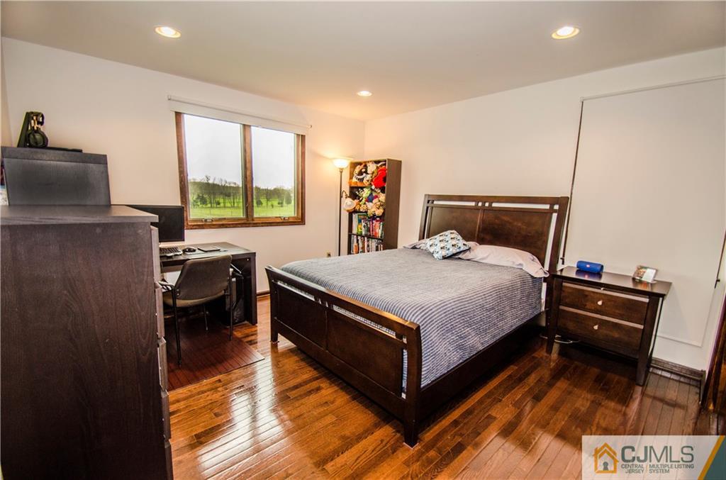29 Yard Road Pennington, NJ 08534 - Photo 14 of 25 a bedroom with a bed and a dresser next to a window