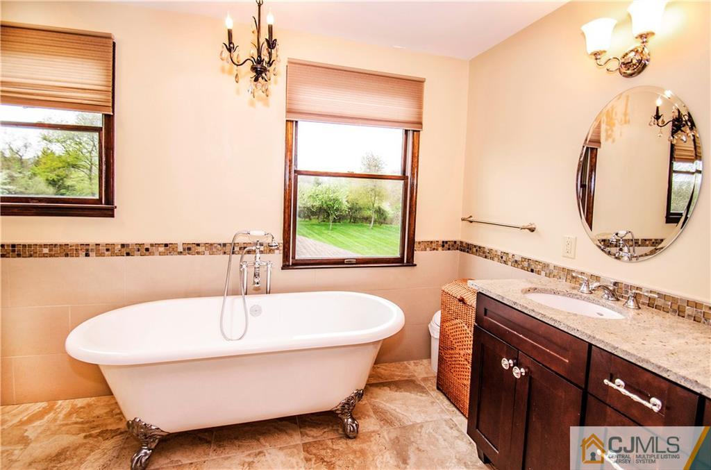 29 Yard Road Pennington, NJ 08534 - Photo 18 of 25 a bathroom with a tub and a sink