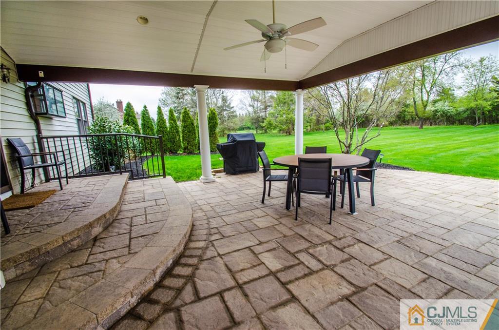 29 Yard Road Pennington, NJ 08534 - Photo 20 of 25 a view of a patio with a table chairs and a yard