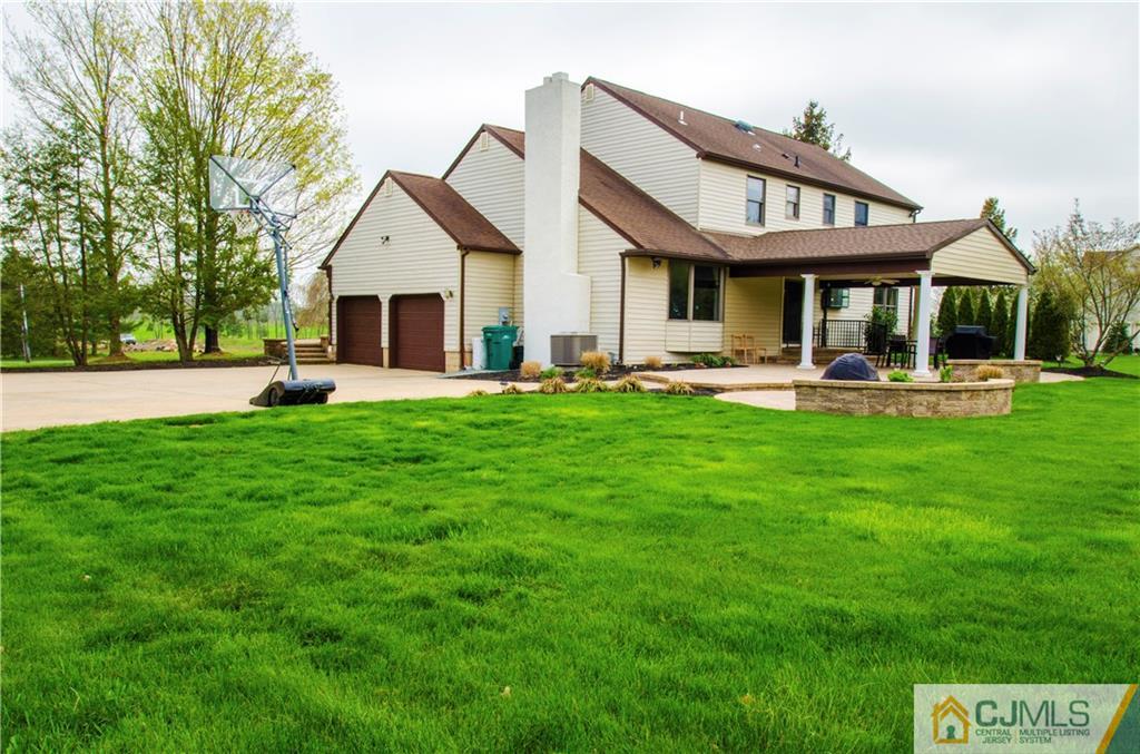 29 Yard Road Pennington, NJ 08534 - Photo 21 of 25 a front view of a house with a yard and trees