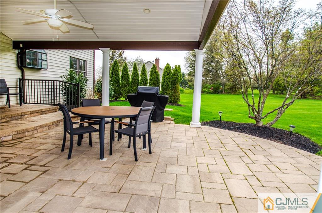 29 Yard Road Pennington, NJ 08534 - Photo 23 of 25 a view of a patio with a table and chairs next to a yard