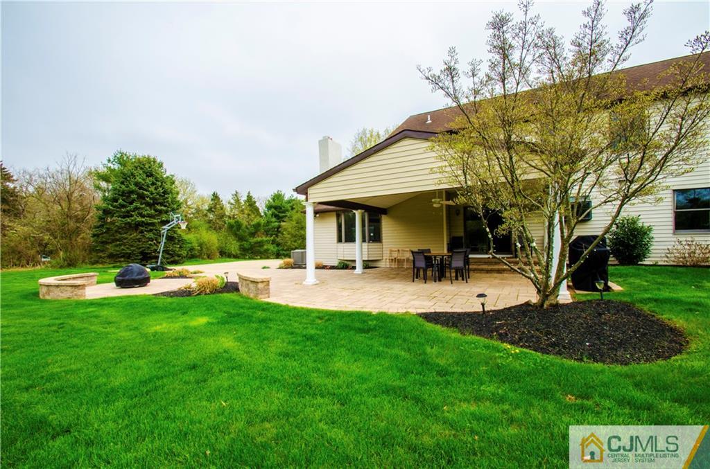 29 Yard Road Pennington, NJ 08534 - Photo 24 of 25 a front view of a house with swimming pool and garden