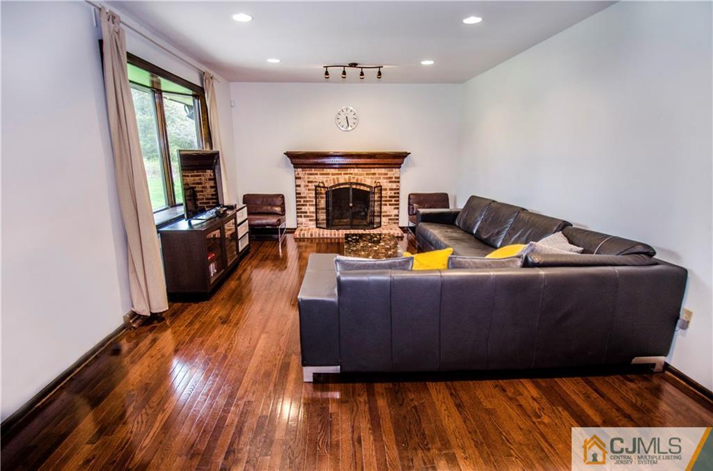 29 Yard Road Pennington, NJ 08534 - Photo 8 of 25 a living room with furniture and a fireplace