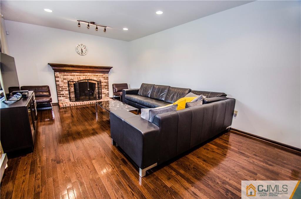 29 Yard Road Pennington, NJ 08534 - Photo 9 of 25 a living room with furniture and a fireplace