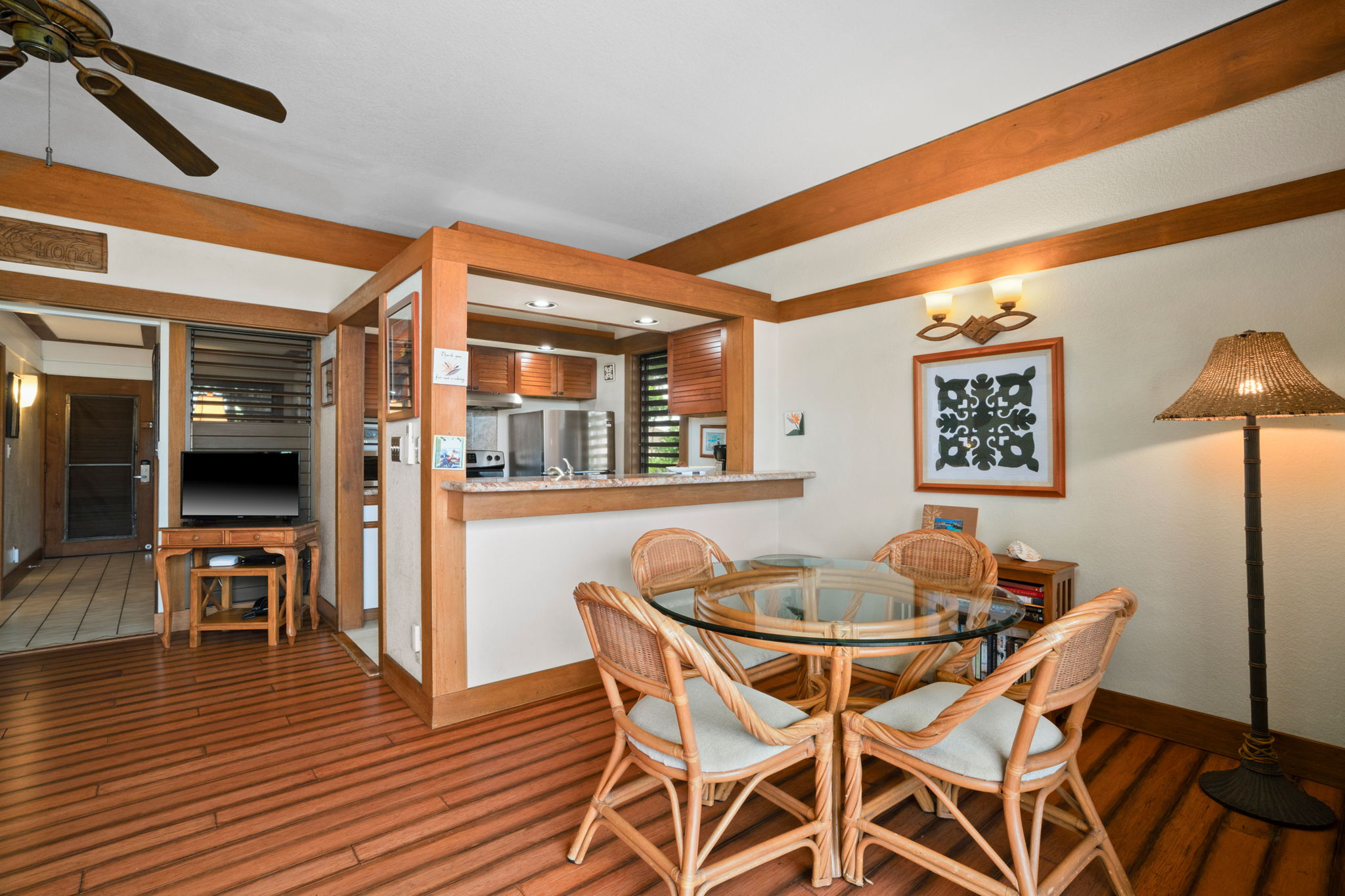 2253 Poipu Road, Unit 330 Koloa, HI 96756 - Photo 6 of 26 a dining room with furniture and wooden floor