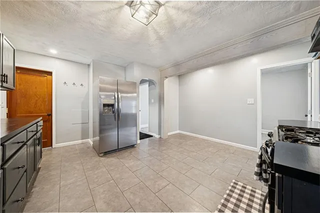 a bathroom with a toilet a sink a mirror and vanity