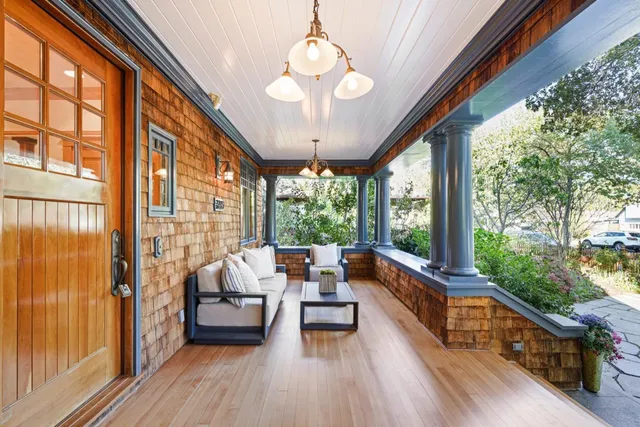 a backyard of a house with yard and outdoor seating