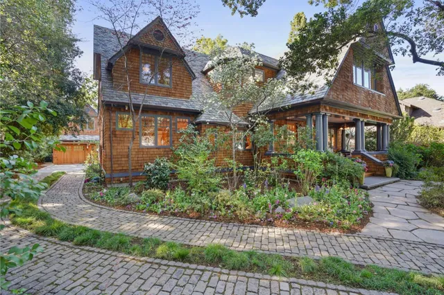 a bathroom with a glass shower door and mirror