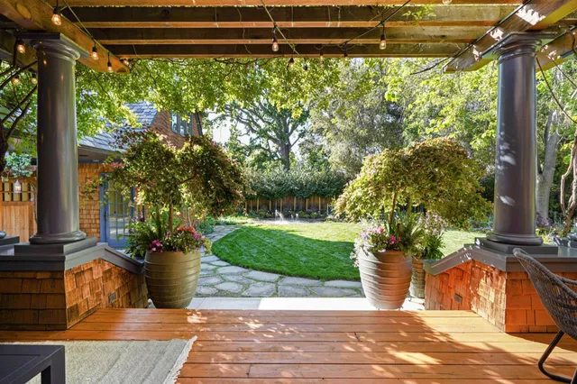 a bedroom with a large bed and a large window