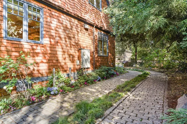 a view of a kitchen with cabinets and washer dryer