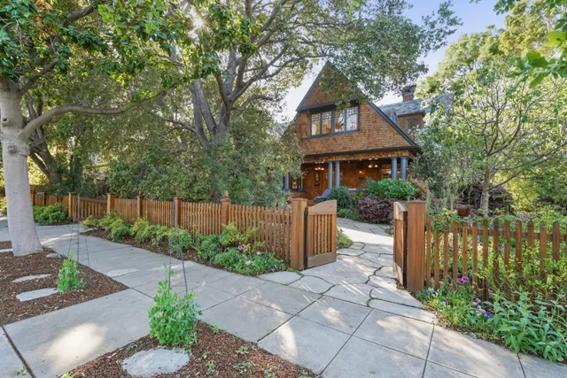 a front view of a house with garden