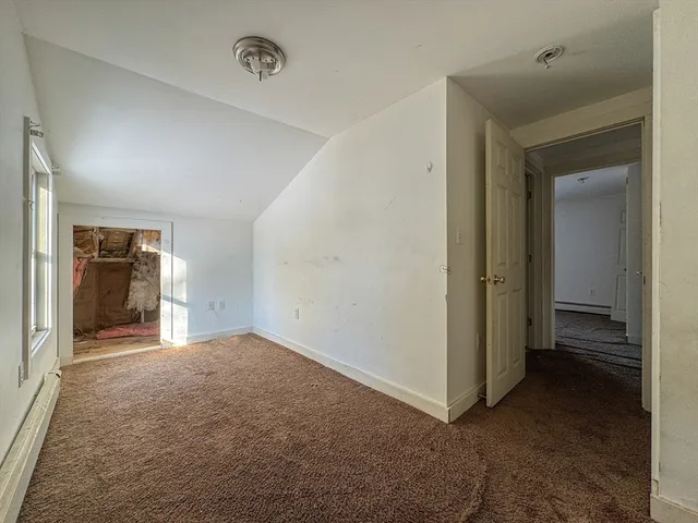 a view of a hallway with a kitchen