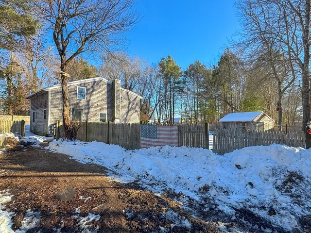 a view of a backyard of snow