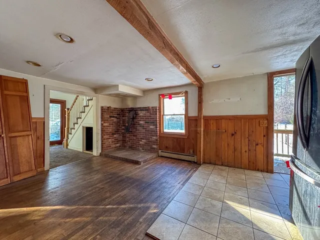 a view of a livingroom with furniture stairs and a ceiling fan