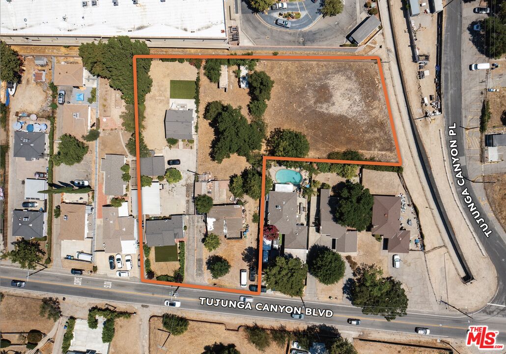 9722 Tujunga Canyon Boulevard Tujunga, CA 91042 - Photo 8 of 8 an aerial view of residential houses with outdoor space