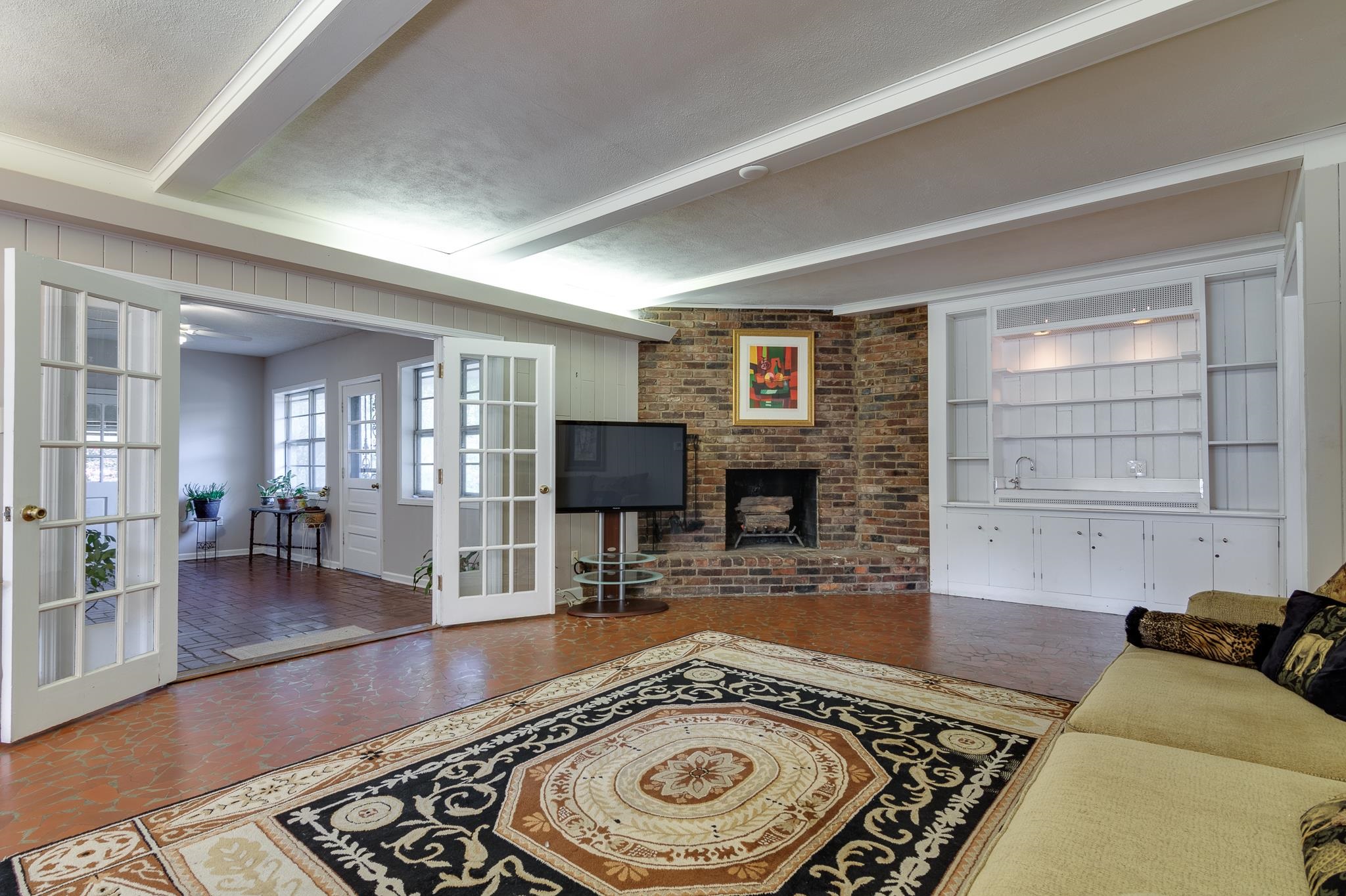 121 South Yates Road Memphis, TN 38120 - Photo 16 of 38 a living room with furniture and a fireplace