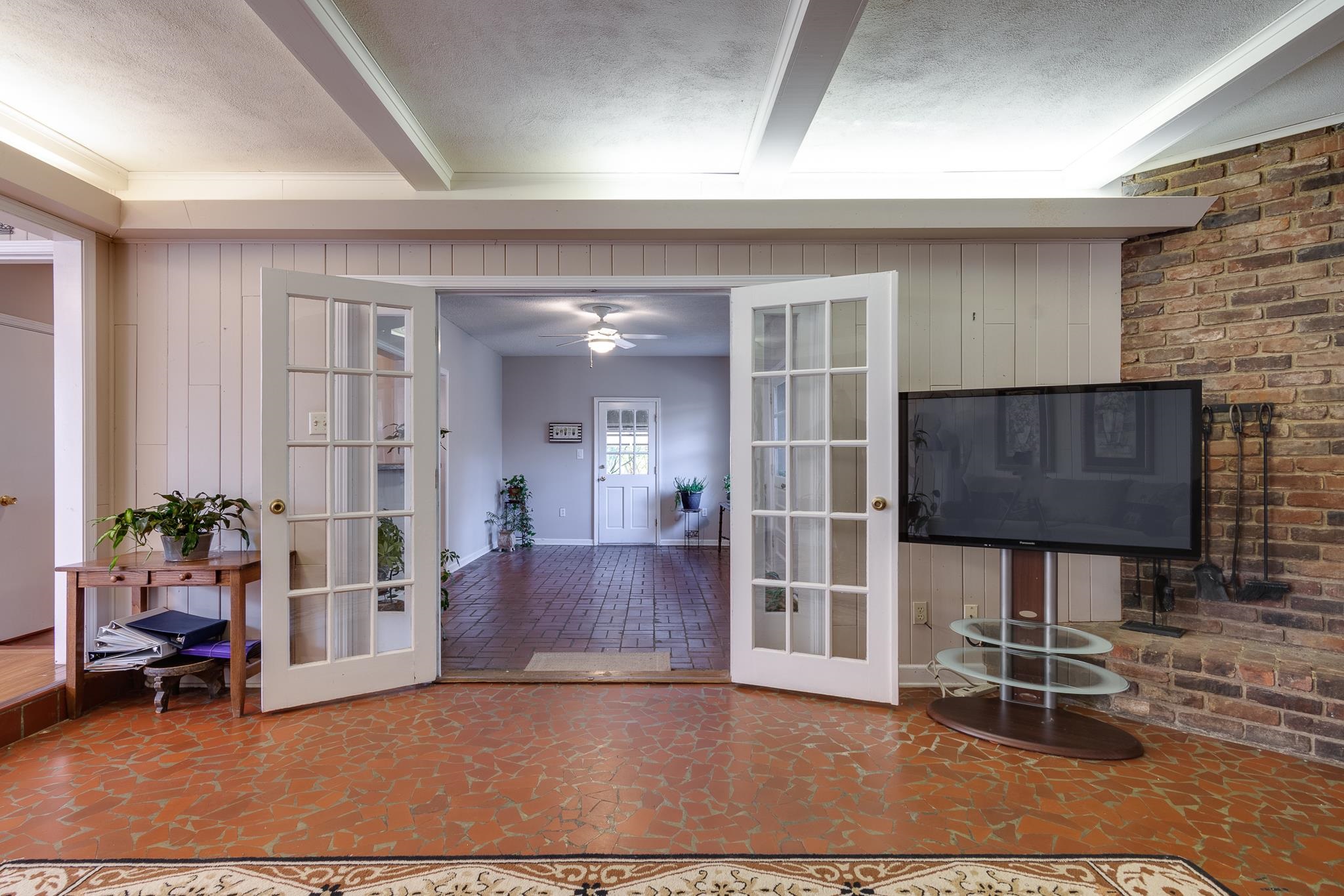 121 South Yates Road Memphis, TN 38120 - Photo 17 of 38 a living room with furniture a dining table and a piano