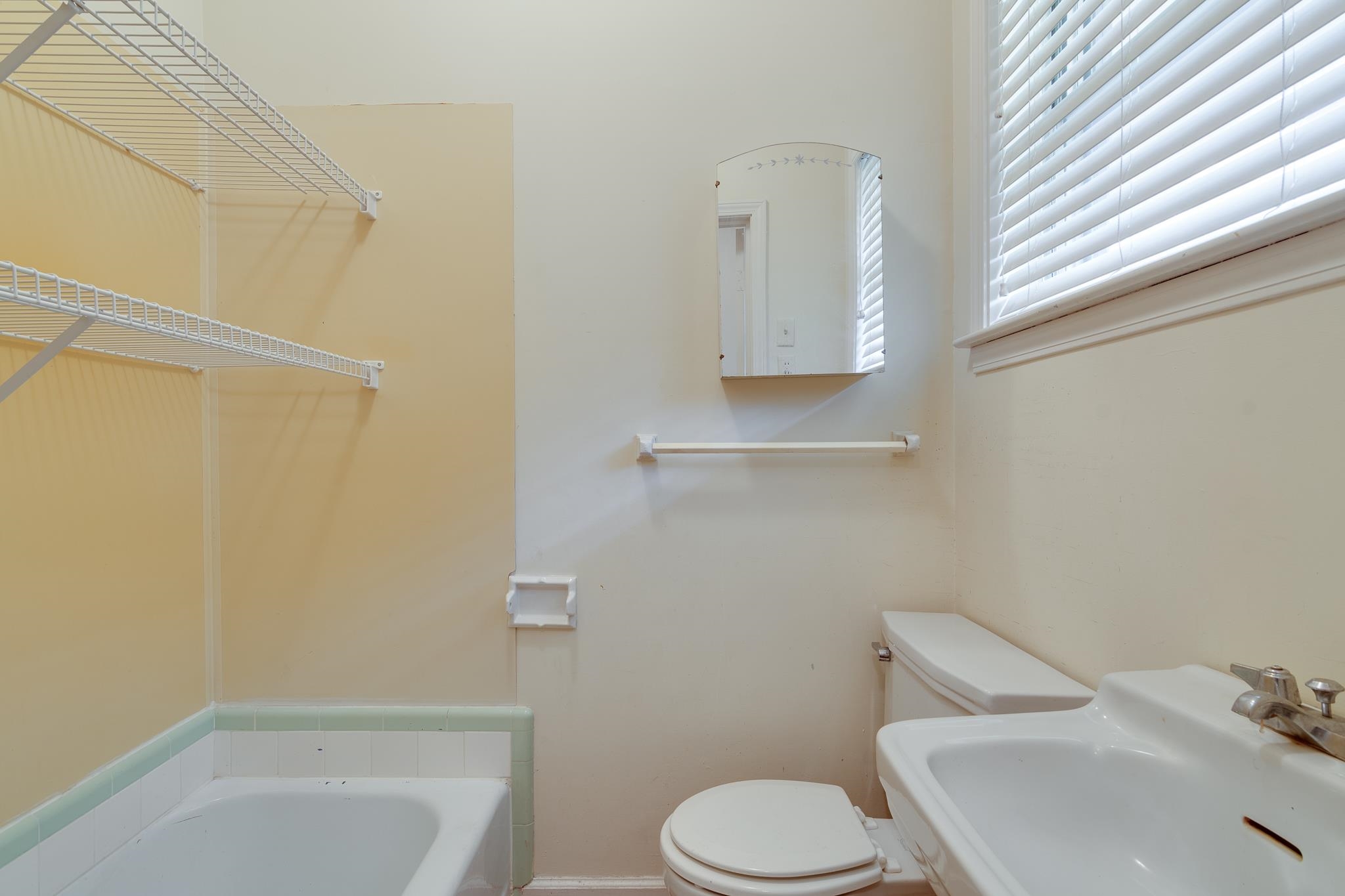 121 South Yates Road Memphis, TN 38120 - Photo 23 of 38 a white toilet sitting next to a bath tub