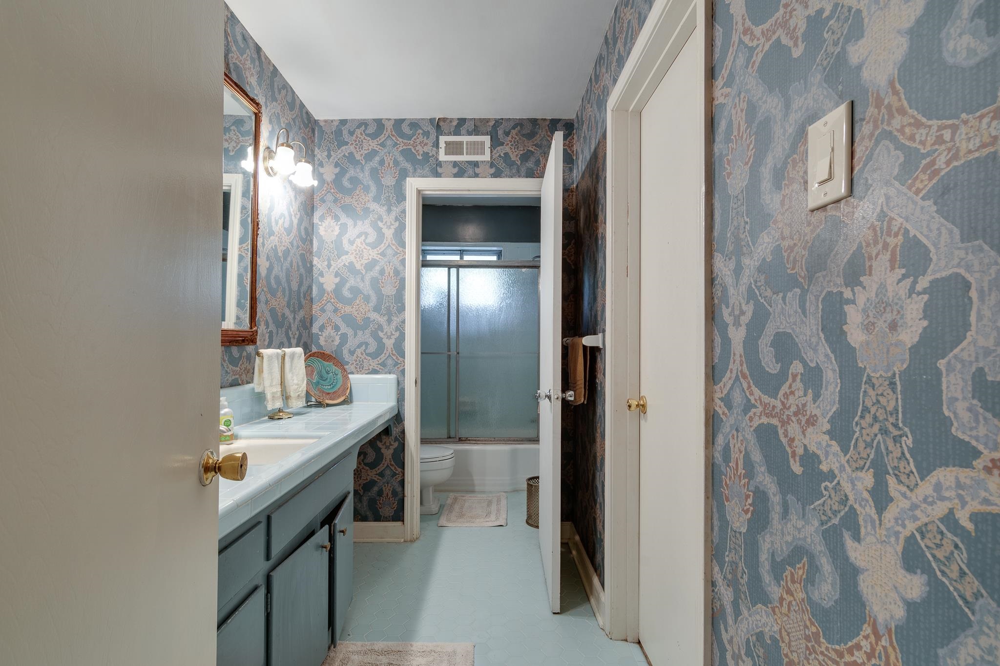 121 South Yates Road Memphis, TN 38120 - Photo 24 of 38 a bathroom with a sink and mirror