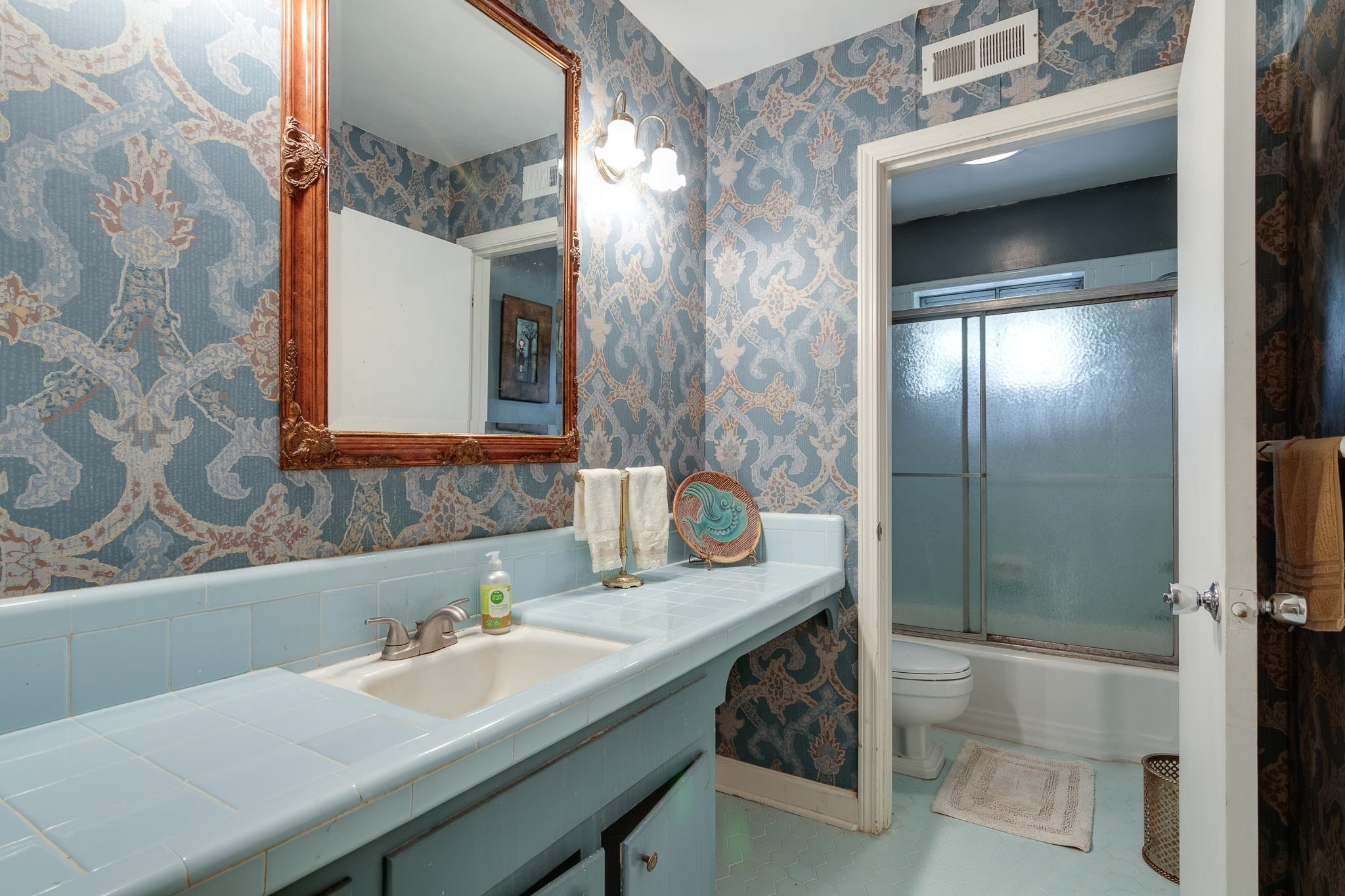 121 South Yates Road Memphis, TN 38120 - Photo 25 of 38 a bathroom with a sink and a mirror