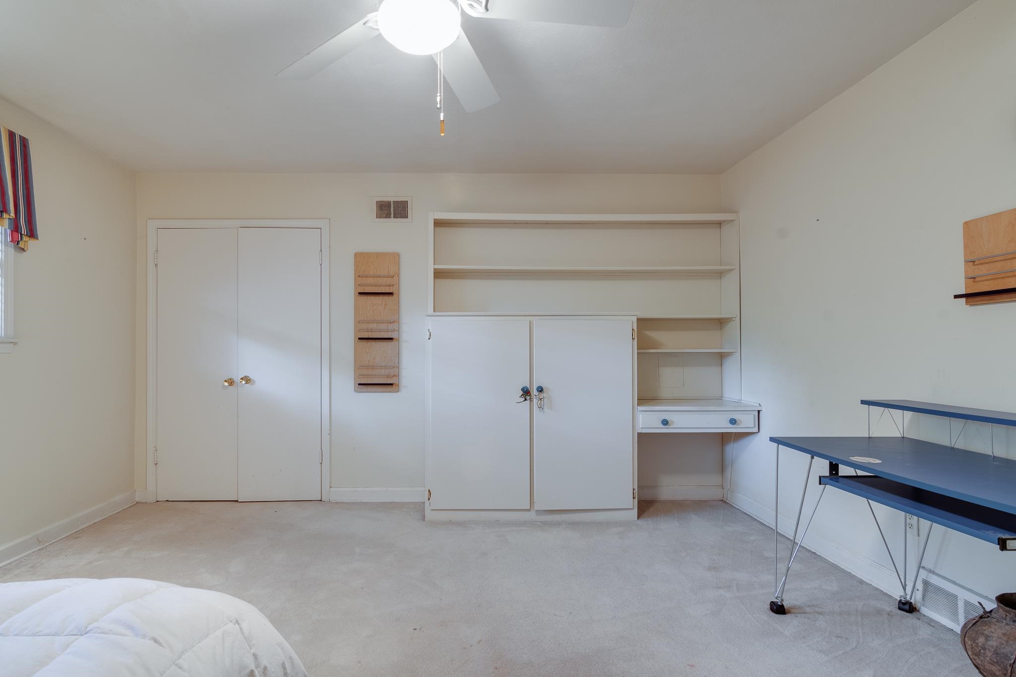 121 South Yates Road Memphis, TN 38120 - Photo 27 of 38 a view of a room with a bench and cabinet