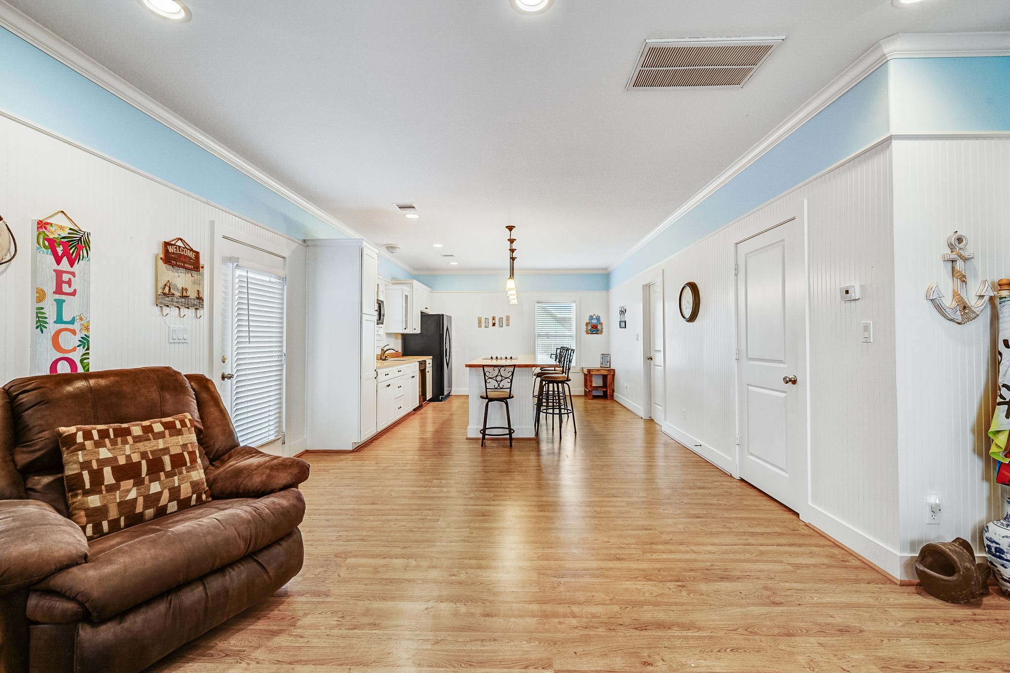 935 Clara Street Crystal Beach, TX 77650 - Photo 11 of 30 a living room with furniture and a wooden floor