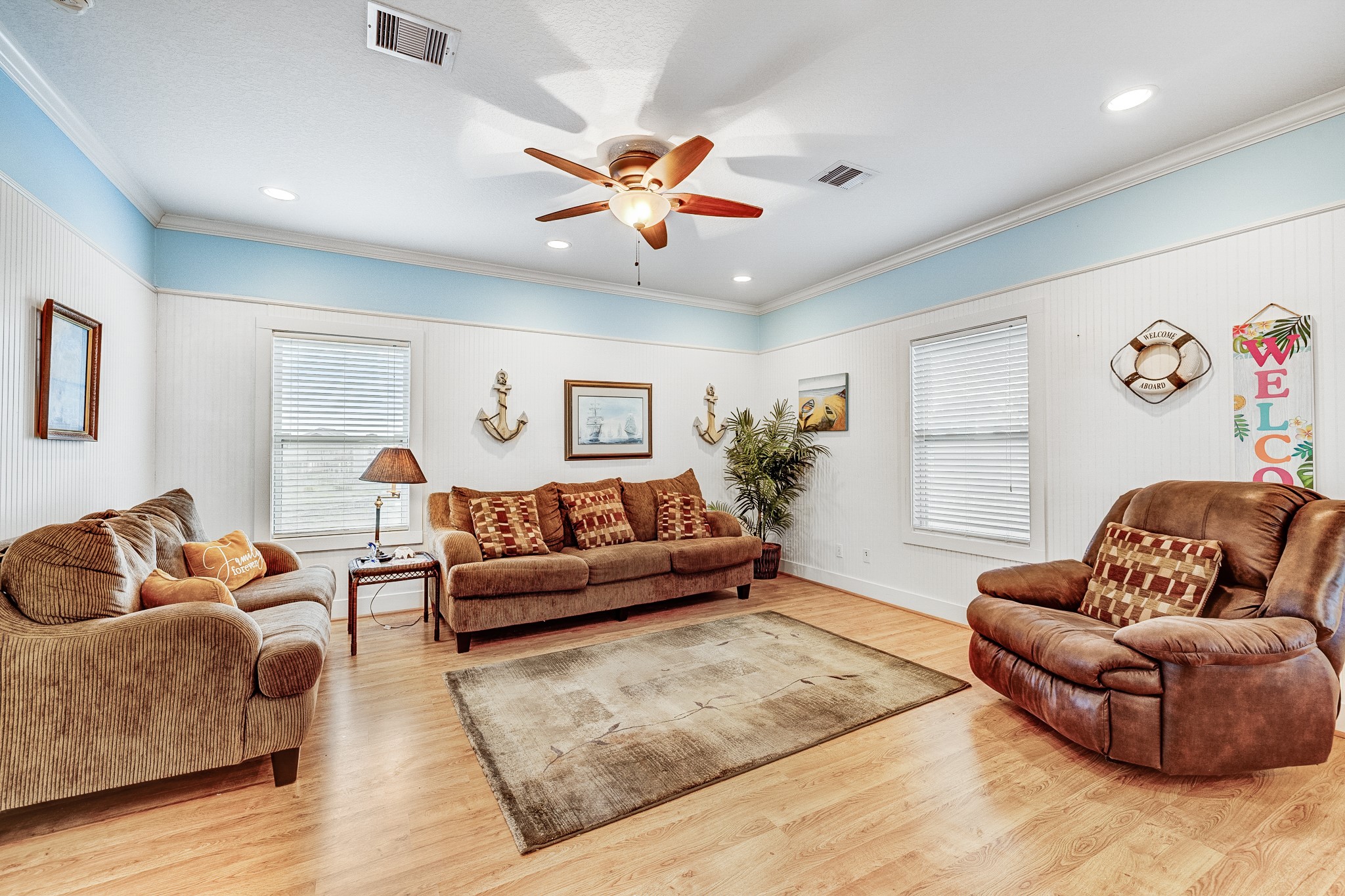 935 Clara Street Crystal Beach, TX 77650 - Photo 14 of 30 a living room with furniture and a large window