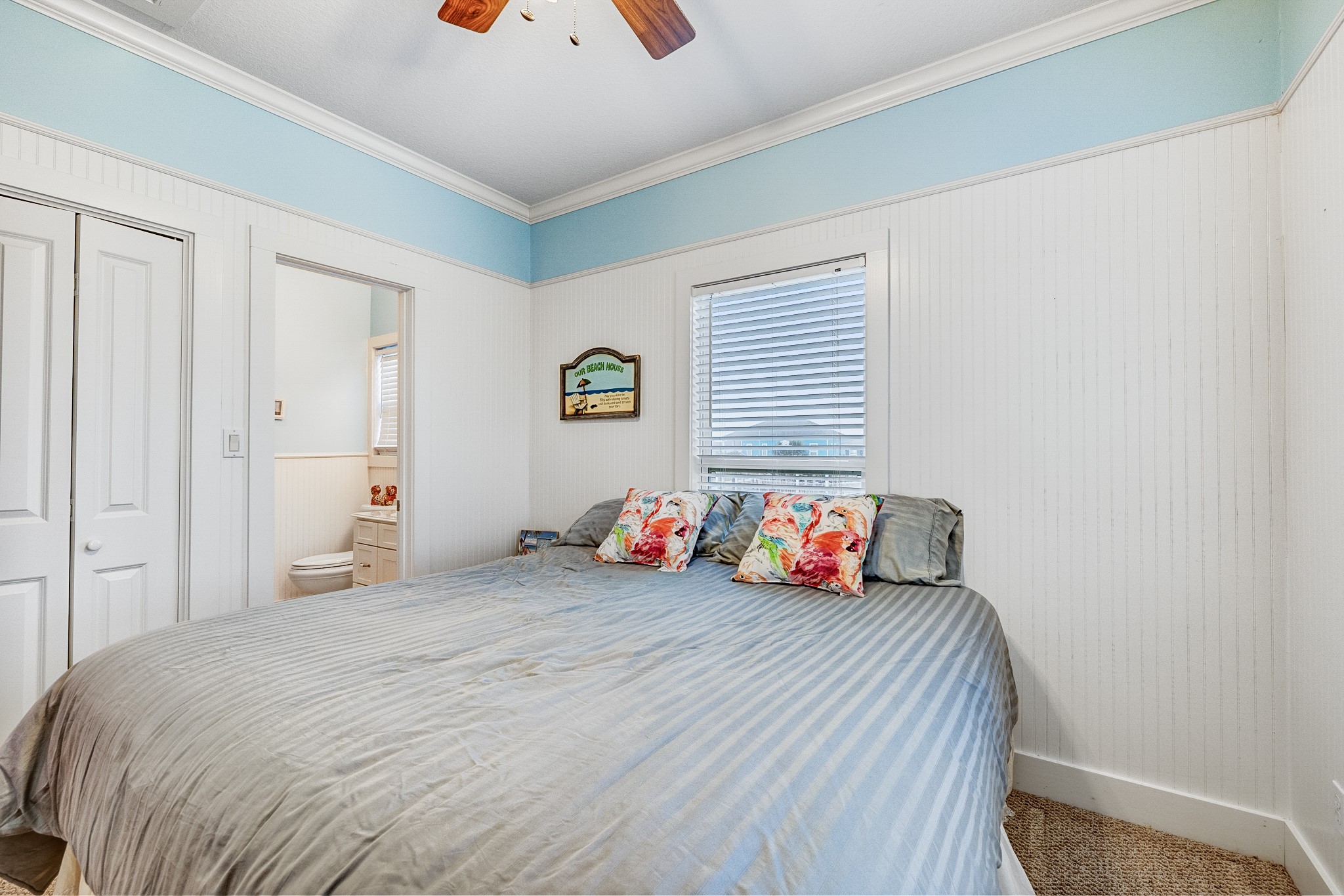935 Clara Street Crystal Beach, TX 77650 - Photo 19 of 30 a bedroom with a bed and a window
