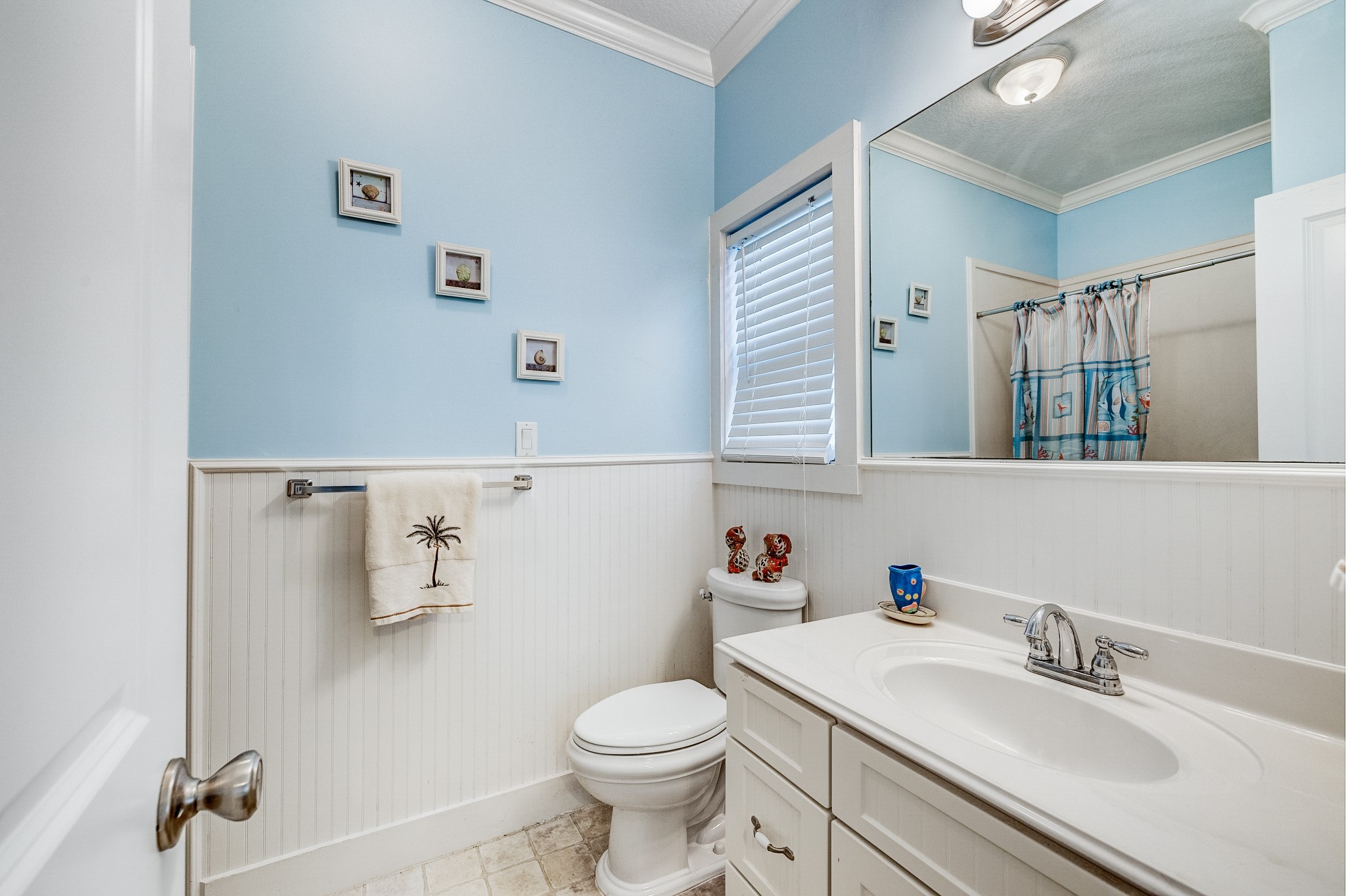 935 Clara Street Crystal Beach, TX 77650 - Photo 20 of 30 a bathroom with a sink toilet and mirror