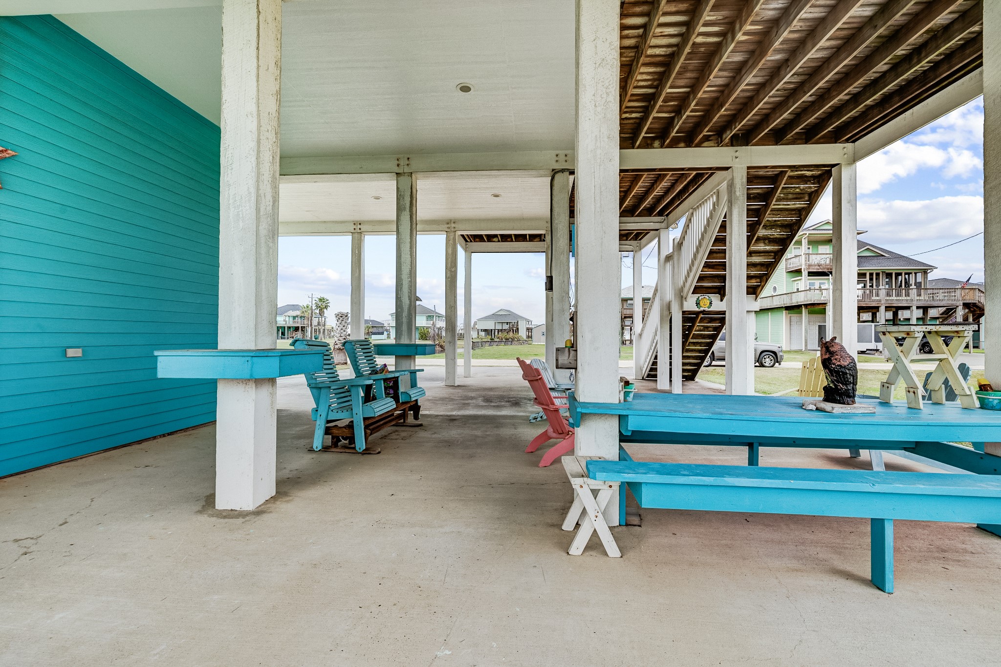 935 Clara Street Crystal Beach, TX 77650 - Photo 2 of 30 a view of building with wooden floor and chair