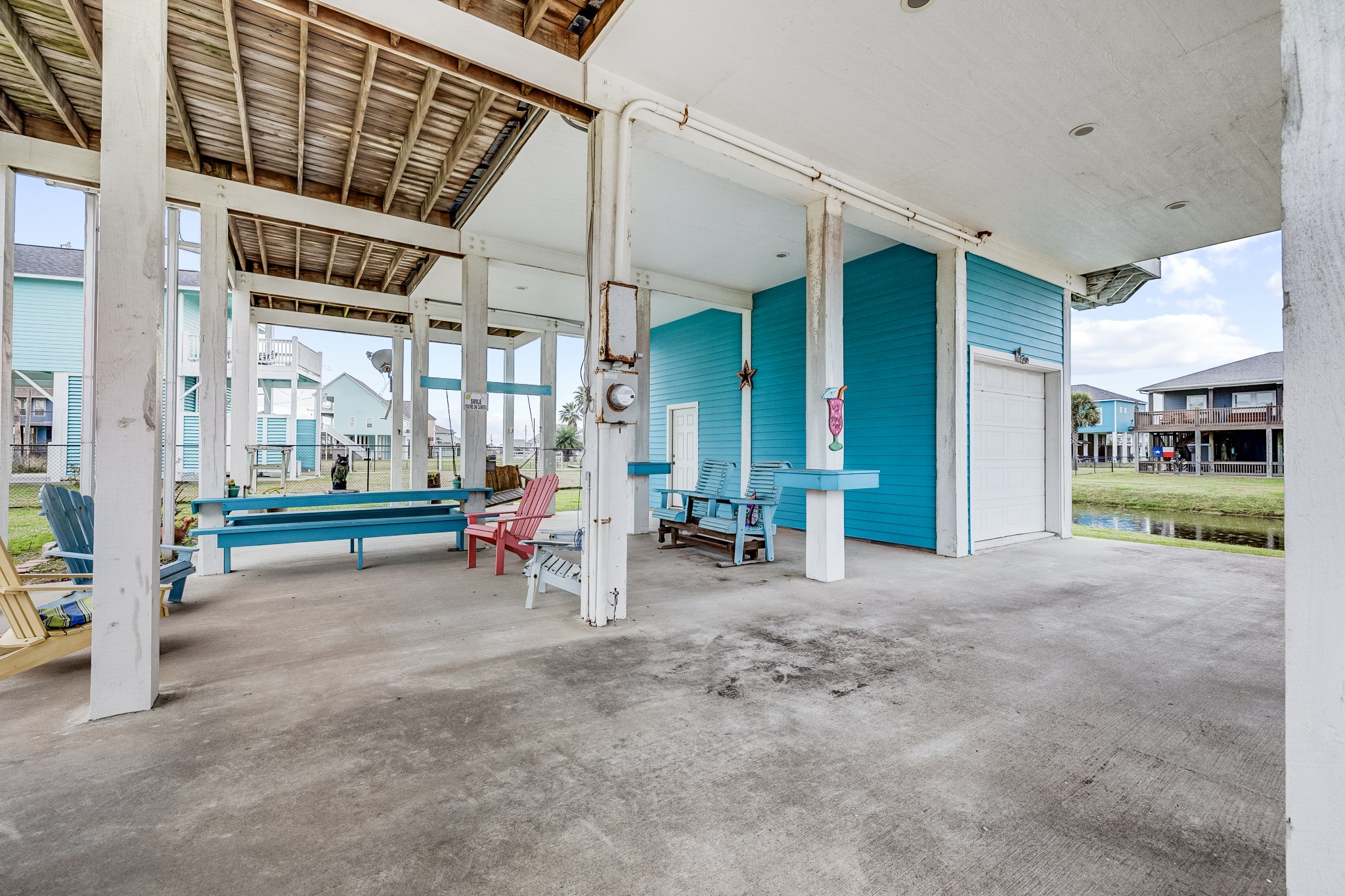 935 Clara Street Crystal Beach, TX 77650 - Photo 21 of 30 a view of a house with porch and furniture