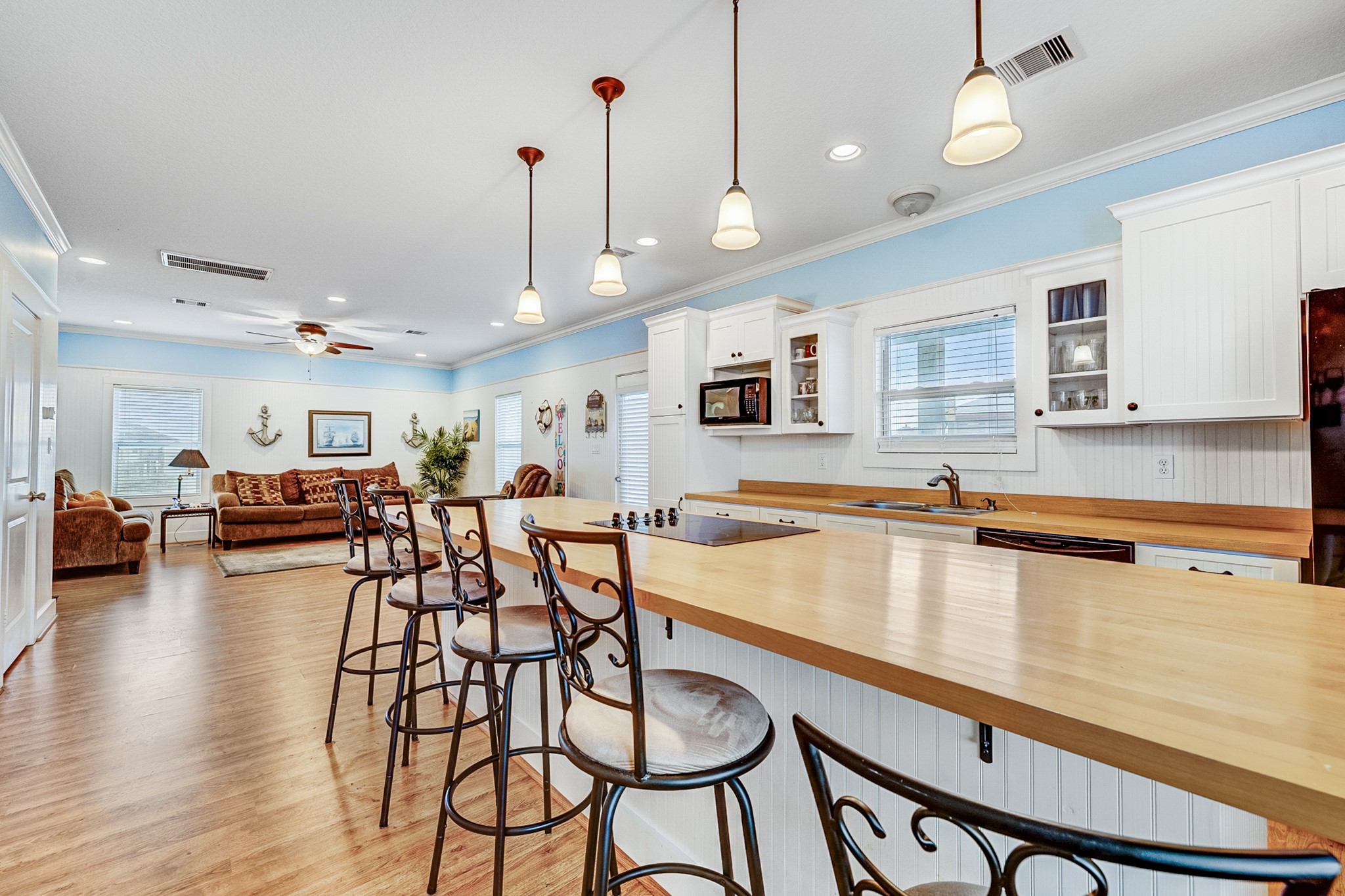 935 Clara Street Crystal Beach, TX 77650 - Photo 8 of 30 a large kitchen with a table and chairs