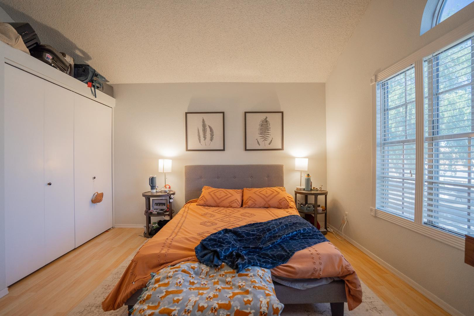 8111 West Wacker Road, Unit 70 Peoria, AZ 85381 - Photo 24 of 38 a bedroom with a bed a closet and next to a window