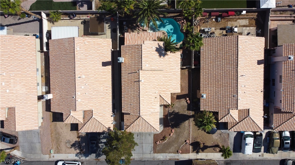 6429 Winding Ridge Las Vegas, NV 89156 - Photo 3 of 16 An aerial perspective reveals a private pool nestled within a residential landscape.