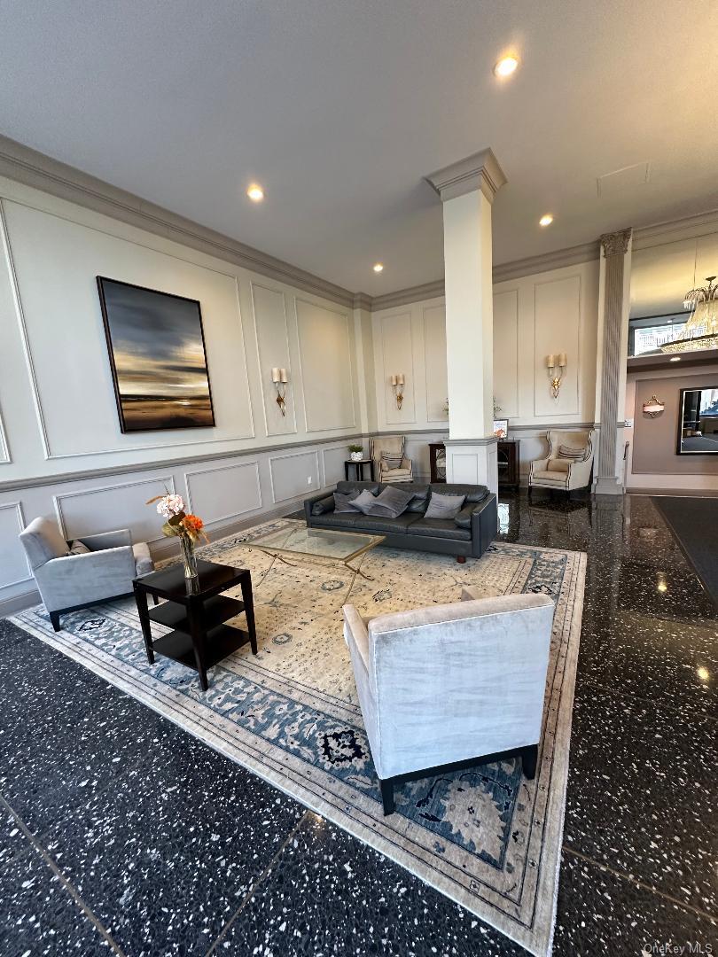 550 Shore Road, Unit 6EE Long Beach, NY 11561 - Photo 2 of 13 a living room with furniture and a couch