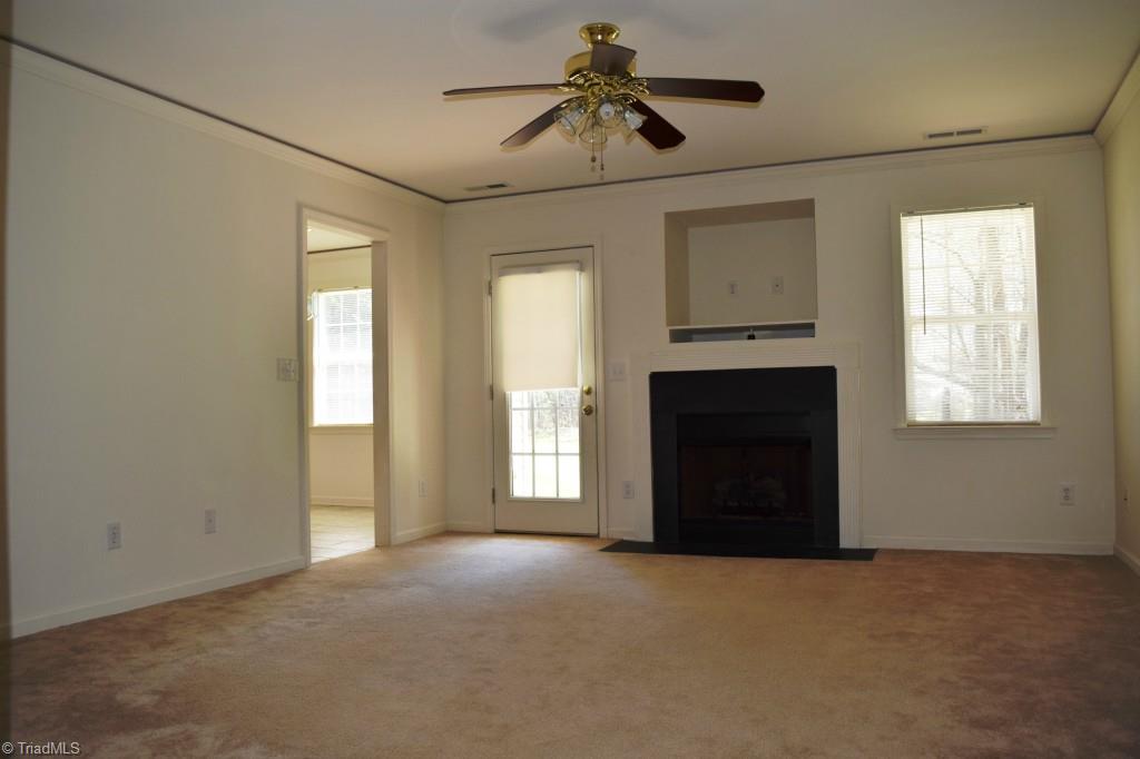 8793 Circle Drive Rural Hall, NC 27045 - Photo 8 of 15 Open living room with fireplace.