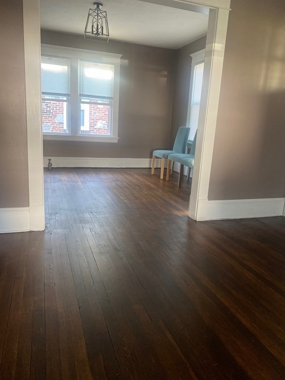 63 Merrimac Avenue Springfield, MA 01104 - Photo 3 of 22 a view of a room with wooden floor and a window