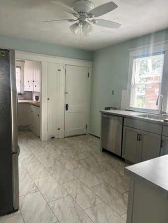 63 Merrimac Avenue Springfield, MA 01104 - Photo 8 of 22 a view of a kitchen with a sink and cabinet area