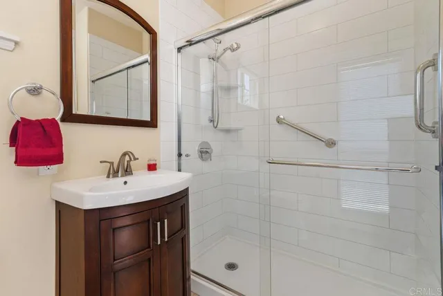 a spacious bathroom with a toilet sink and mirror