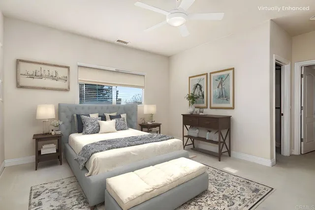 a spacious bedroom with a bed and a flat screen tv