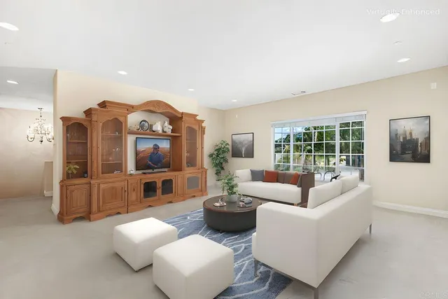 a large kitchen with a large counter top and sink