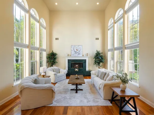 a view of a dining room with furniture wooden floor and a chandelier