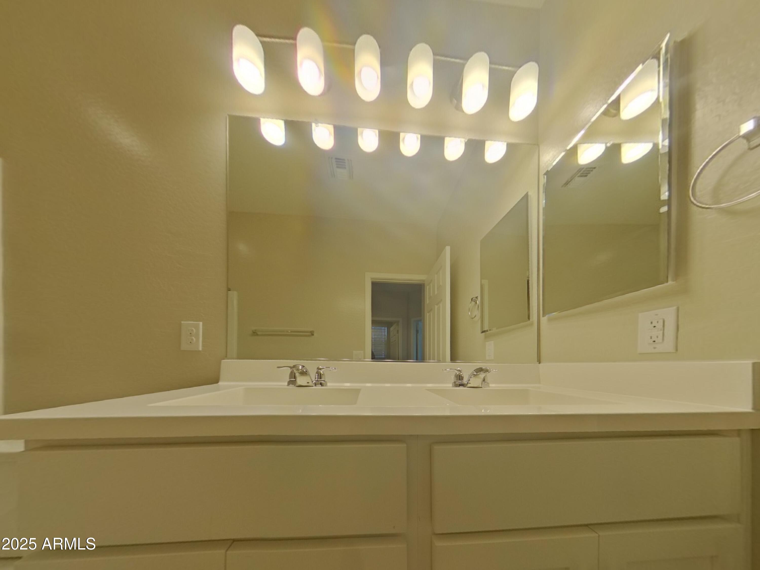 2929 North 28th Street, Unit 13 Phoenix, AZ 85016 - Photo 14 of 16 a bathroom with a sink and a mirror