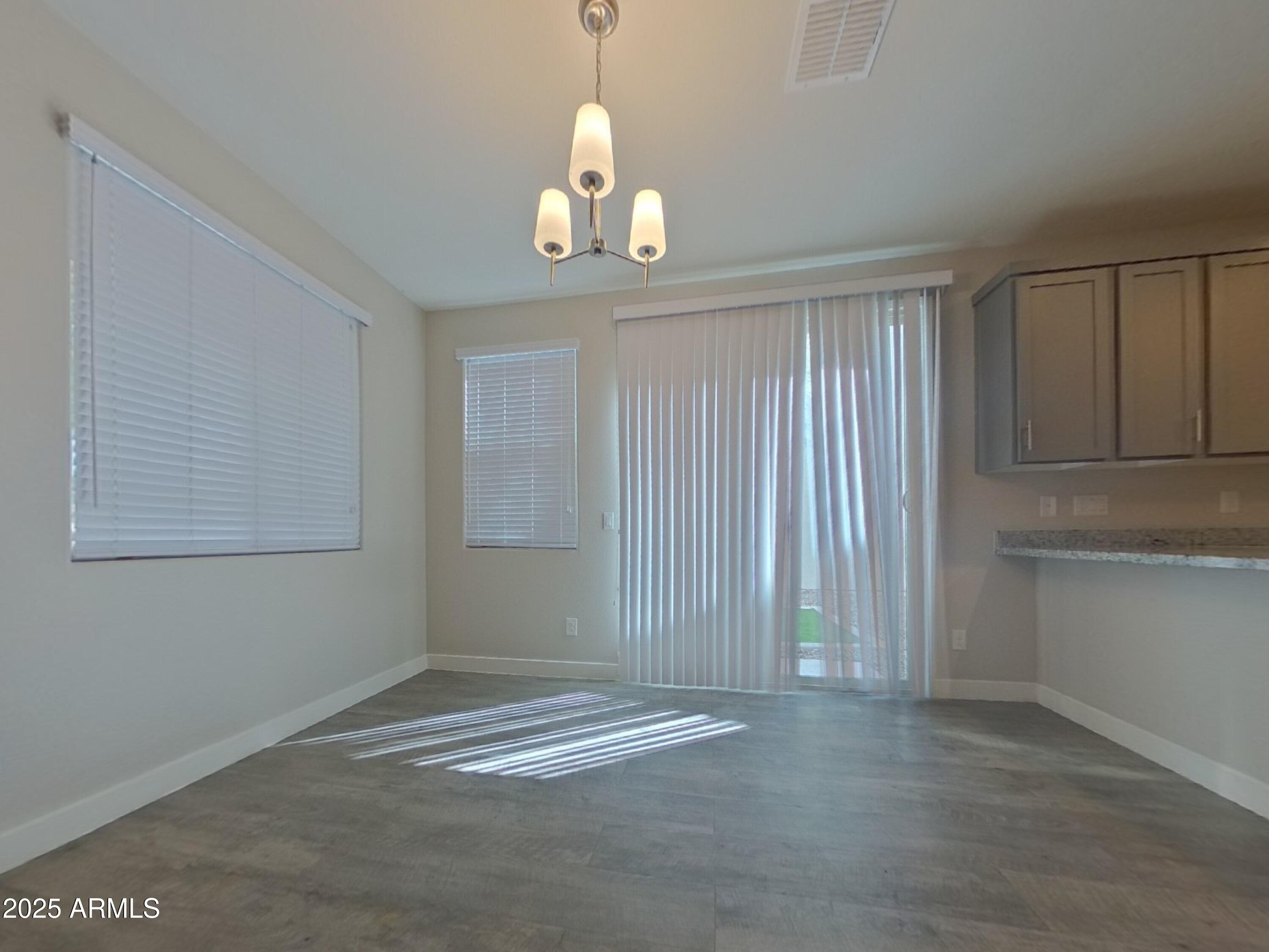 2929 North 28th Street, Unit 13 Phoenix, AZ 85016 - Photo 2 of 16 an empty room with windows